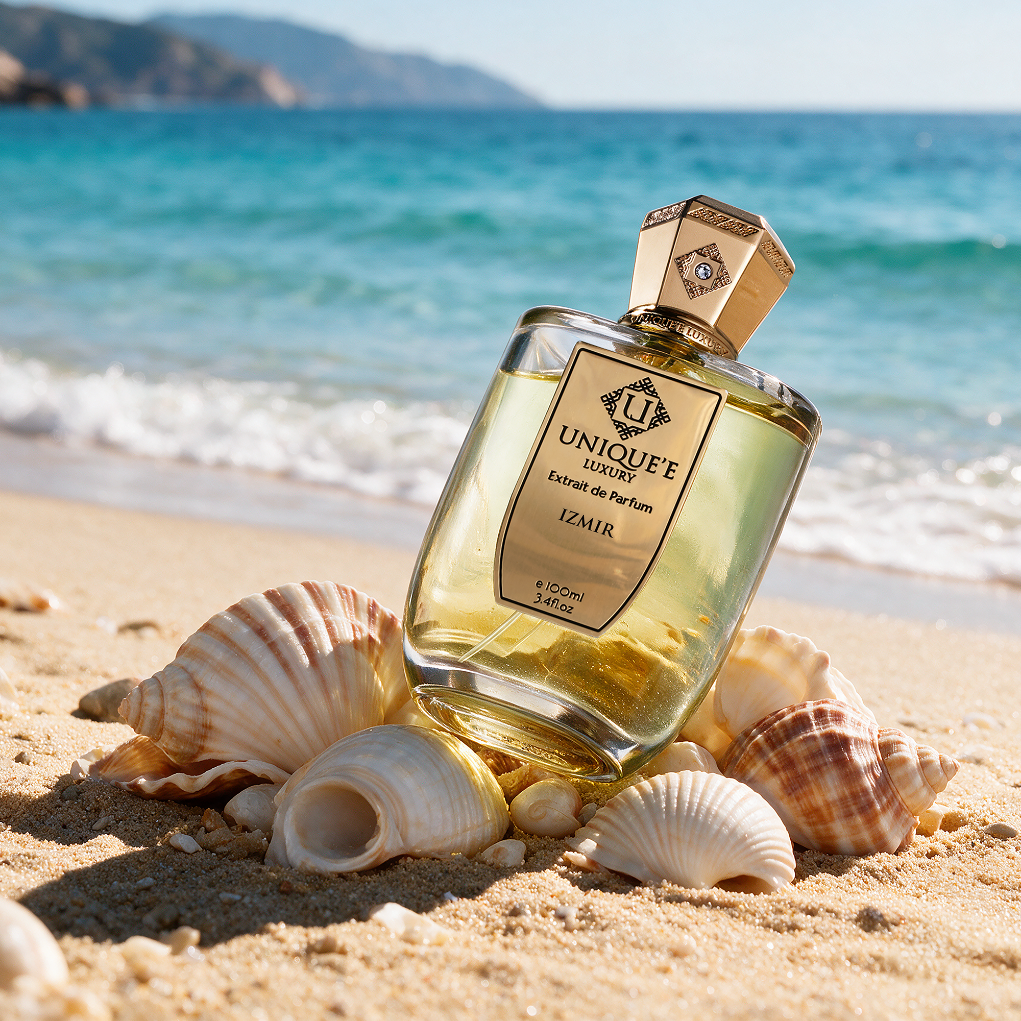 A bottle of Unique'e Luxury Izmir perfume with a gold cap and label, containing 100 ml of extract de Parfum.